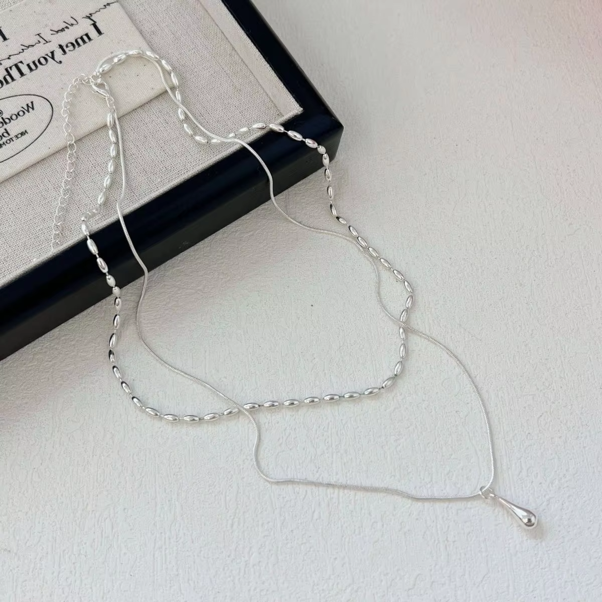 Double-Layer Water Drop Pendant Necklace for Women, Niche Design, Trendy, High-End Fashion, Simple Everyday Rice Bead Clavicle Chain