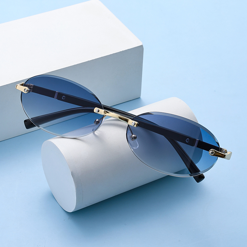 Populaire Dames Heren Shades Ovale Zonnebril Voor Vrouwelijke Mannelijke Zomer Reizen UV400 Randloze Zonnebril Ronde Mode