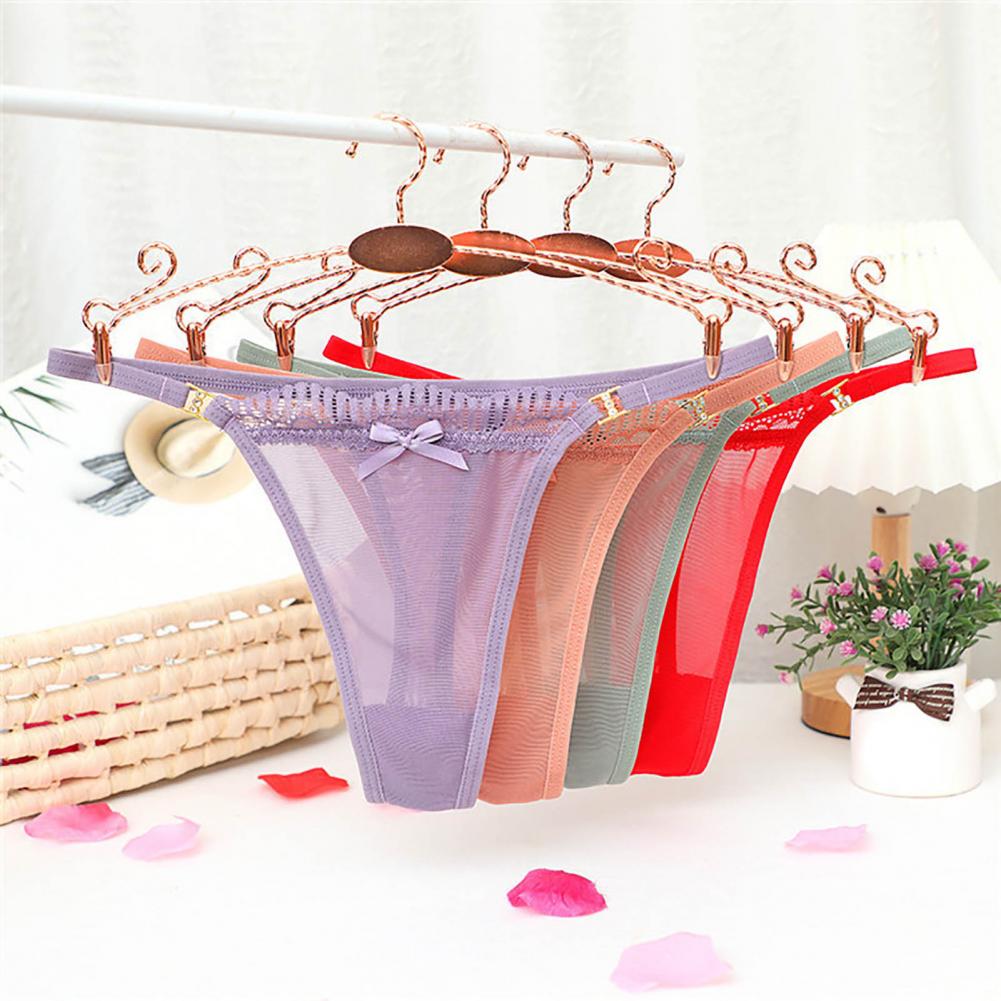 Tanga Sexy ultrafina con adorno de encaje para mujer, Tanga de tiro bajo con hilo de red transparente con decoración de lazo