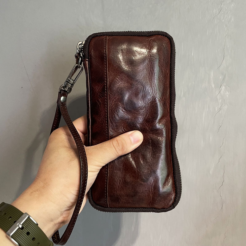 AETOO, nueva cartera de cuero para hombre, con cremallera larga, moderna, retro, para teléfono móvil, bolso de mano sencillo japonés y coreano para hombre, bolso de cuero para hombre